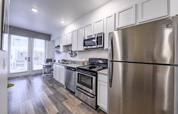kitchen with appliances and patio doors